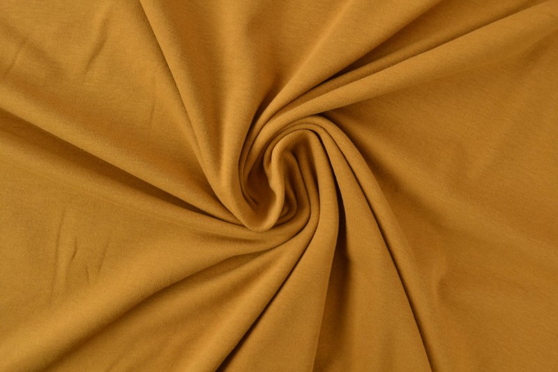Katoen tricot donker okergeel